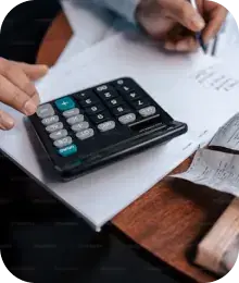 man calculating his finances using calculator