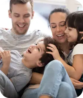  mother and father under clear sky and father playing with his son